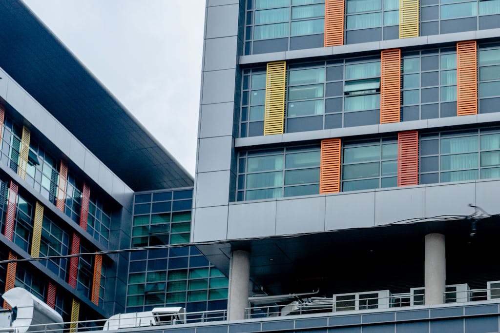 Modern building with colorful facade and glass windows showcasing urban architecture.
